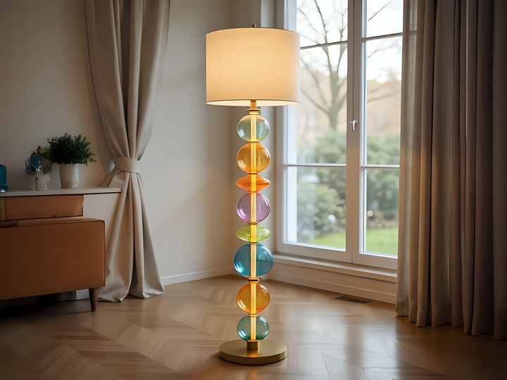 Colorful floor lamp in a room with a window and curtains